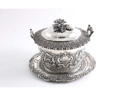 A WILLIAM IV IRISH BUTTER DISH &amp; COVER on stand with decorative borders, twin handles and a clear glass liner, the dish w