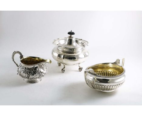 A LATE VICTORIAN CIRCULAR BOX OR CADDY on scroll feet with a rising cover, by C.C. Pilling, London 1900, together with a Geor