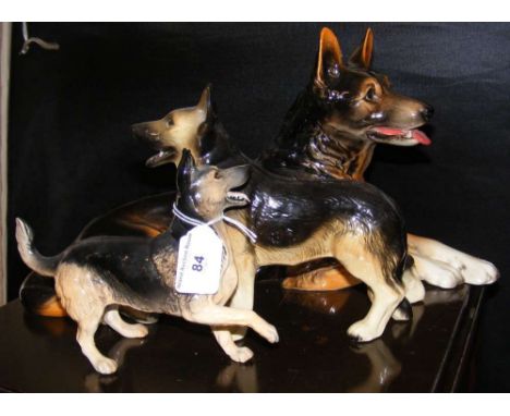 A Royal Doulton Alsatian dog ornament, together with a large Goebel dog ornament, etc.