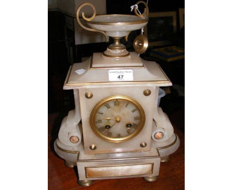 An onyx striking mantel clock