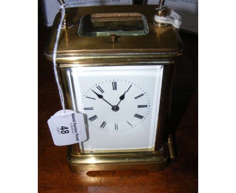 A 13cm brass carriage clock with hour repeat movement