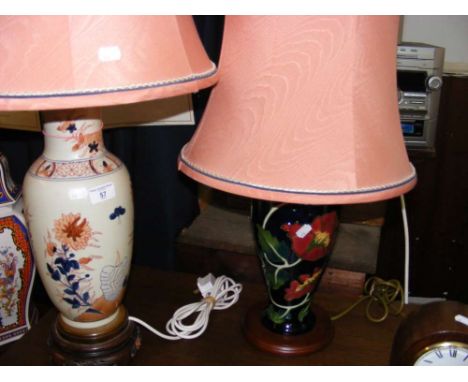 A Moorcroft style ceramic table lamp and a similar ditto with matching shades