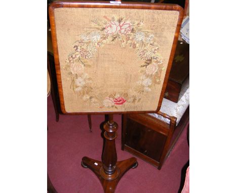 A Victorian mahogany pole screen with tapestry panel