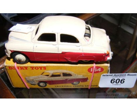 A boxed Dinky Toys No.164 Vauxhall Saloon in maroon and cream