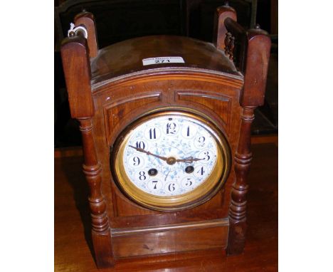 An Arts & Crafts style antique mantel clock with a blue dial