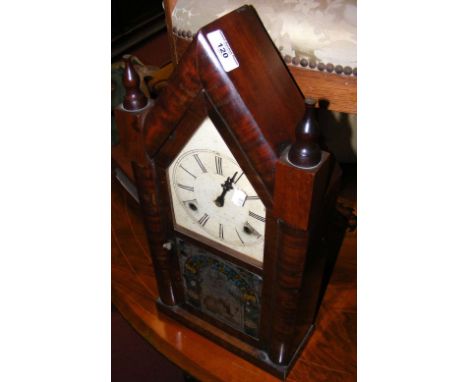 Mahogany cased American striking mantel clock with decorative glazed door