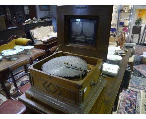 Marquetry inlaid walnut Polyhphon, late 19th century, the table top musical disc player playing from 40cm metal discs, the co