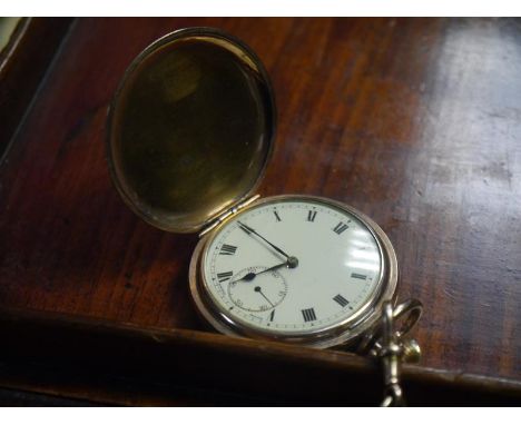 Late 19th.c gold plated full hunter pocket watch, the cream enamel dial with Roman numerals and subsidiary seconds dial, keyl