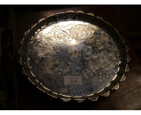 Victorian silver salver, Henry Wilkinson & Co., London 1872, with engraved well, pierced scalloped rim and raised on scroll f