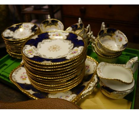 Coalport porcelain tea service, c. 1900, in gadroon cobalt pattern no. 2665, comprising twelve cups and saucers, twelve tea p