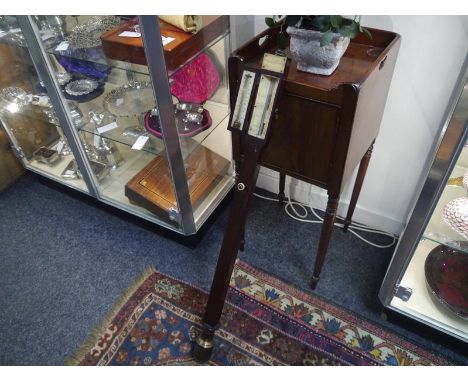 19th Century mahogany marine stick barometer, the door enclosing ivory thermometer and scale, with brass reservoir and bearin