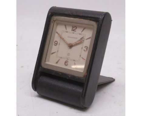 Jaeger LeCoultre 2 day travel alarm, signed cream dial, primary Arabic indices, secondary baton indices, folding leather clad