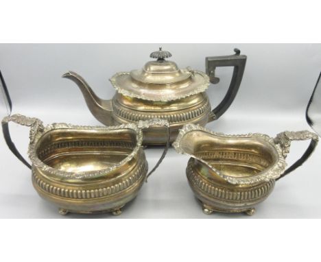 Three piece Edwardian silver tea service to include teapot, twin handled sugar bowl and milk jug, each with oblique gadrooned