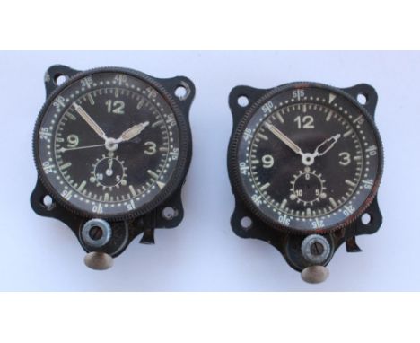 Two Luftwaffe Junghans F1 23885 cockpit clocks. One complete with all hands. The other has second hands missing. Serial numbe