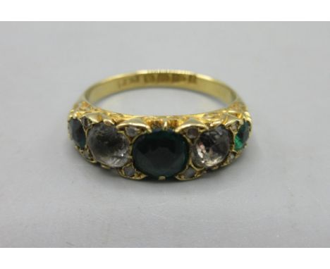 18ct yellow gold ring set with green and clear stones, stamped 18, 3.5g
