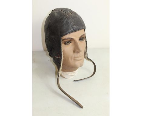 WWII Siemens LKpW101 Luftwaffe flying helmet with wool lining. Displayed on vintage realistic plastic mannequin head with hai