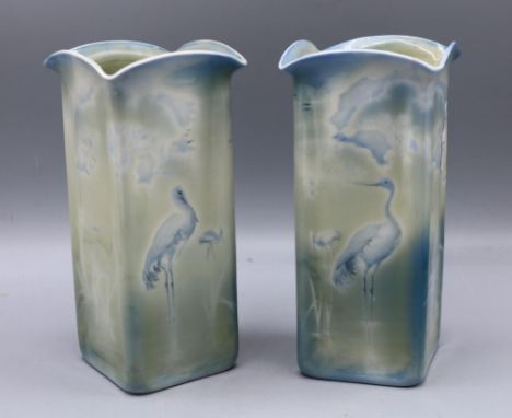 Pair of Royal Worcester Sabrina Ware vases, blue and green glaze with wading storks, H19cm (2)