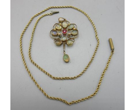 Edwardian yellow gold drop pendant set with moonstone and ruby, worn stamp, 3.7g, and a yellow metal chain, 2.3g