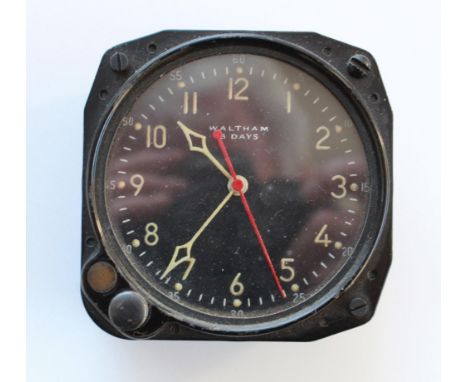8 Day cockpit clock by Waltham. Luminous hour and minute hands, red second hand. Good working order