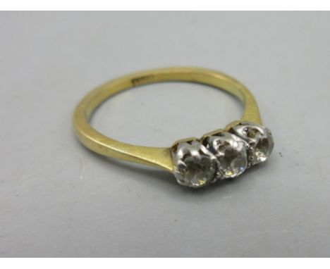 18ct yellow gold and white metal three stone diamond ring, size O1/2, stamped 18ct, 2.7g