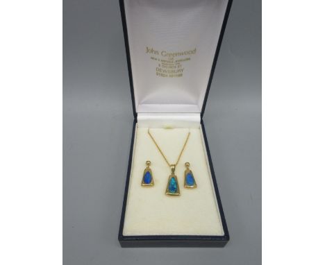 yellow metal unmarked pendant set with opal, on 9ct yellow gold chain, stamped 375, and a pair of matching 14ct gold earrings
