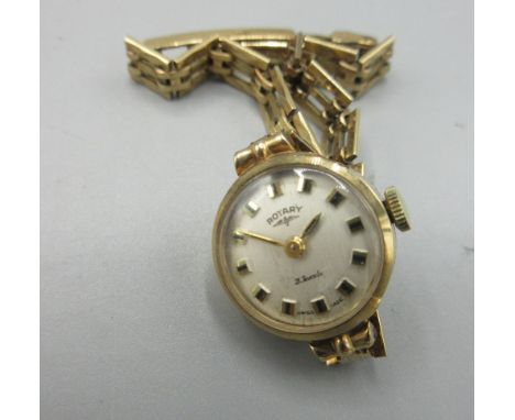 Rotary ladies 9ct gold wristwatch on 9ct gold gate type bracelet, hallmarked .375, signed brushed silvered dial, baton indice