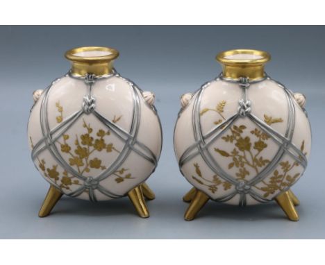 Pair of Mintons Aesthetic Movement moon flask vases, decorated in silver and gilt, one restored, H12cm