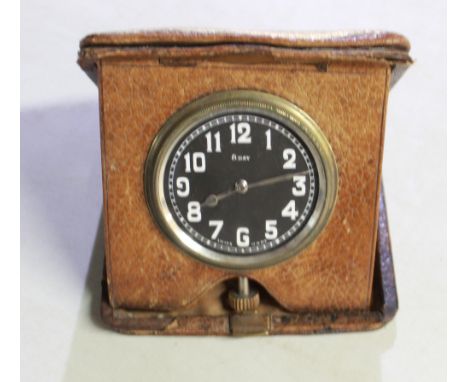 Hebdomas type 8 day travel clock, tan leather folding case, 2 1/4" black Arabic dial, case no. 6110, H10cm and Eterna 8 day b