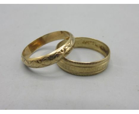 9ct yellow gold band ring with engraved border detail, and a wedding band with waved engraved design, both stamped 375, 4.0g