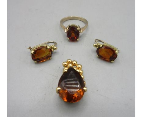 18ct yellow gold pendant set with pear cut orange stone, stamped 18k, a pair of similar yellow metal unmarked drop earrings, 