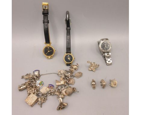 Hallmarked Sterling silver charm bracelet, a 9ct yellow gold pendant set with clear stone, a ladies Tissot watch PR50 Automat
