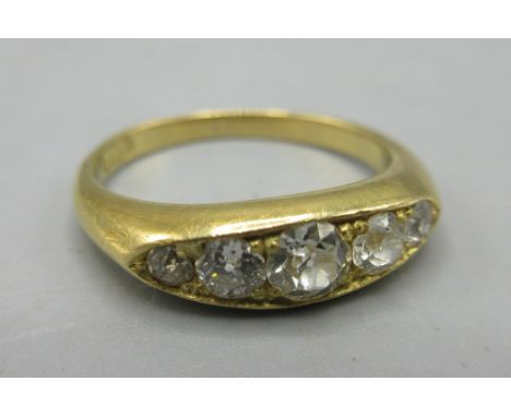 Yellow metal ring set with five diamonds in rub over setting, size J, no hallmark, 3.5g
