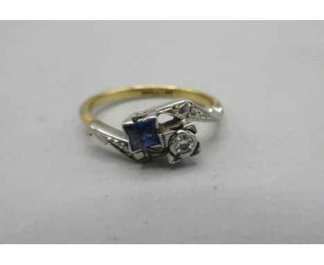18ct yellow gold and platinum ring set with round cut diamond and square cut sapphire on cut shoulders, stamped 18ct Plat, 2.