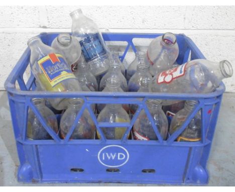 Collection of twenty five vintage glass milk bottles advertising Horlicks, Colgate, Kit-Kat, etc in blue plastic crate, (25)