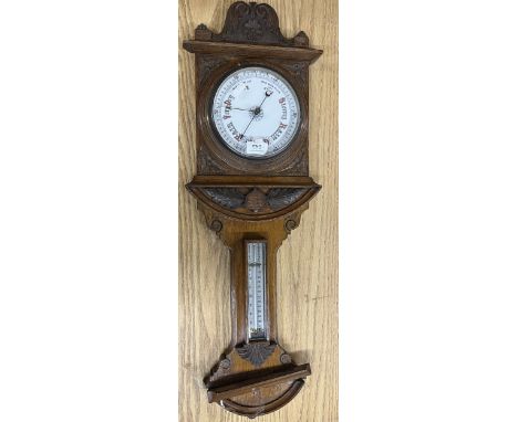 Early 20th Century carved oak aneroid barometer with thermometer box, H79cm