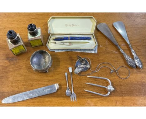 Two hallmarked silver handled steel shoe horns, a silver bread knife and fork (no handles), silver mustard spoon and pickle f