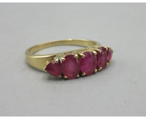 14ct yellow gold ring set with five rubies, stamped 585, 3.7g