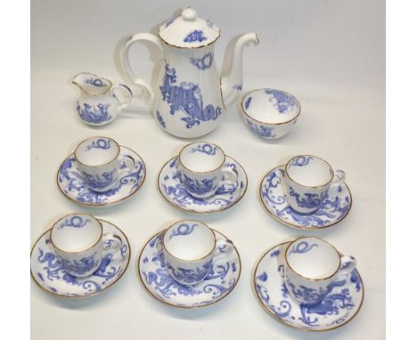 Royal Worcester Blue Dragon pattern coffee set, comprising coffee pot, six cups and saucers, sugar bowl, and jug
