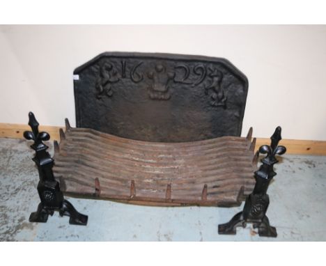 17th century style cast iron fire back, fleur-de-lys, lion and unicorn, a pair of similar implement rests and a cast iron gra