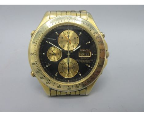 Seiko Olympic gold plated quartz 1/100 second chronograph wristwatch with day date on original multilink bracelet, signed bla
