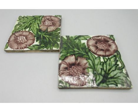Pair of William de Morgan, Merton Abbey period square tiles with pink anemone design on a cream ground, impressed Merton Abbe