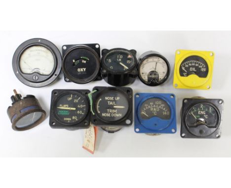 Collection of dials from various aircraft and eras. Oil pressure, engine temperature, Flaps up and down (2) Nose up nose down