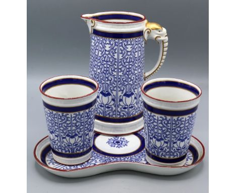 Royal Worcester blue and white Royal Lily pattern lemonade set, comprising jug with elephant handle, two beakers, and trefoil