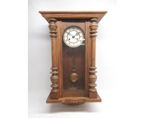 German walnut Vienna type wall clock, 5 3/4" brass dial, Roman chapter ring, unsigned two train movement striking on a gong, 