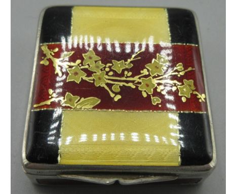 Art Deco silver enamelled pill box in square form, hinged lid decorated in a floral red, yellow and black enamel design, engi