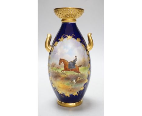 A Grainger &amp; Co. Worcester two handled vase painted with a fox hunting scene in a raised gilt panel on a cobalt blue grou