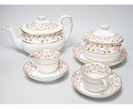 An early 19th century part tea service, teapot and cover, a sucrier and cover, two cups and saucers and a saucer-dish