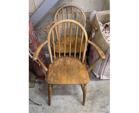 A pair of Ercol elm and beech elbow chairs, width 60cm, depth 40cm, height 82cm