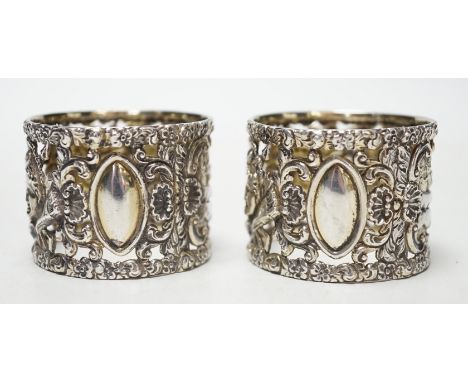 A pair of Edwardian silver serviette rings, pierced and embossed with deer hunting scenes, Wakely &amp; Wheeler, London, 1906