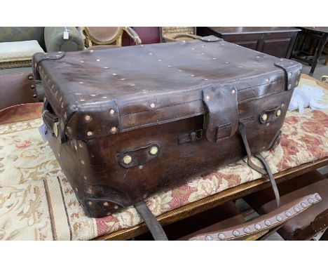 A Victorian leather brass and copper studded travelling trunk, width 89cm, depth 53cm, height 37cm